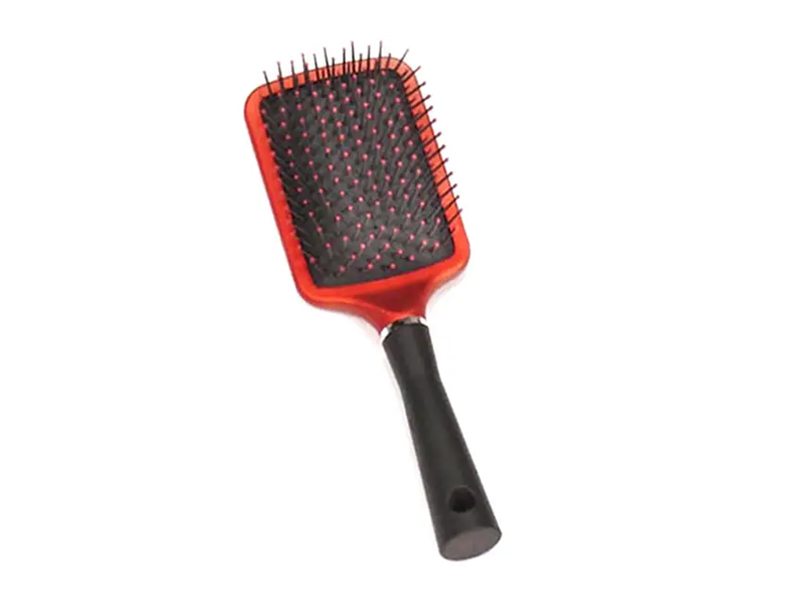 Cepillo de pelo de plástico con revestimiento de goma