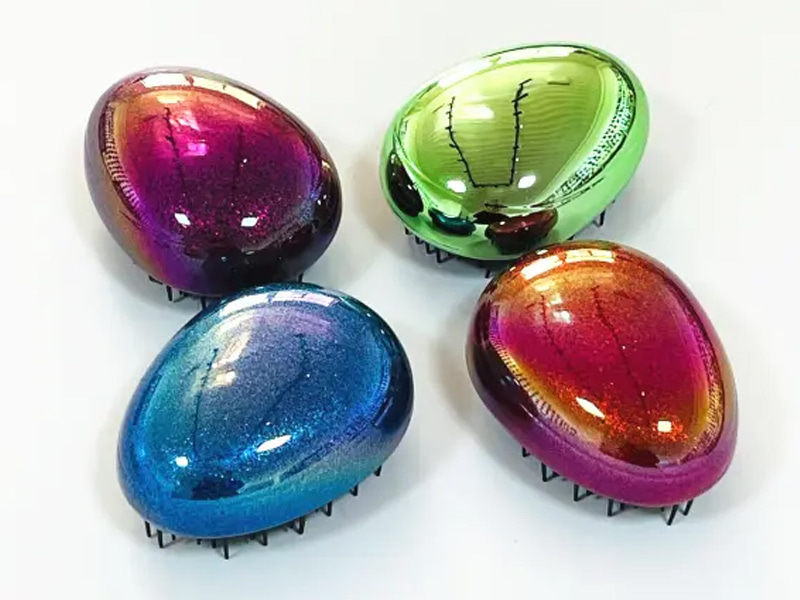Mini cepillo para el cabello para desenredar en forma de huevo para niños