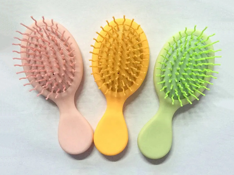 Mini cepillo de pelo colorido para desenredar para niños