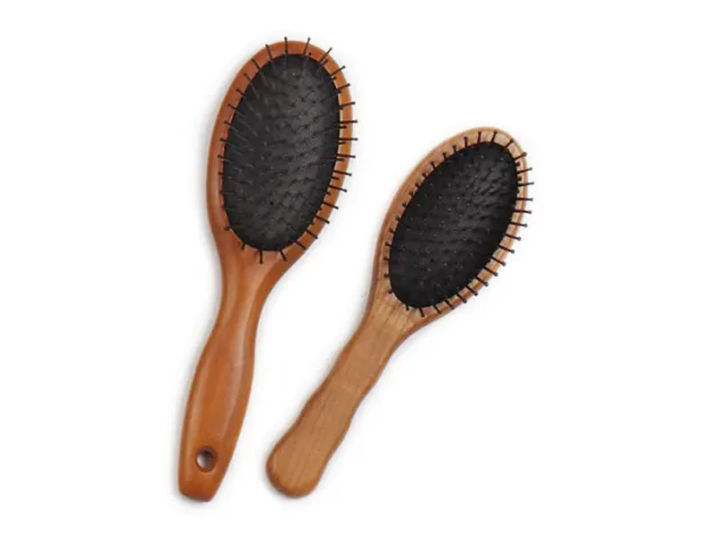 Cepillo de pelo con pasadores de cojín de madera