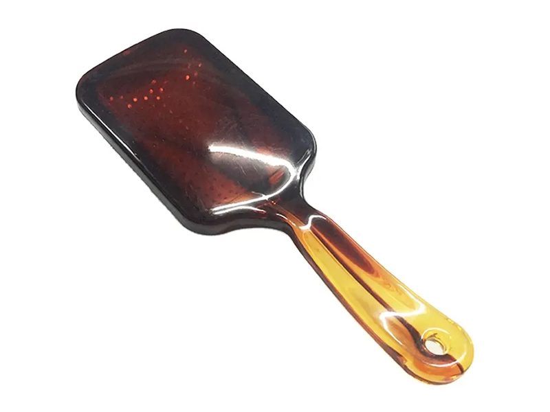 Cepillo de pelo de paleta de color ámbar con pasadores de metal