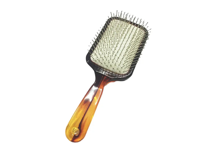 Cepillo de pelo de paleta de color ámbar con pasadores de metal
